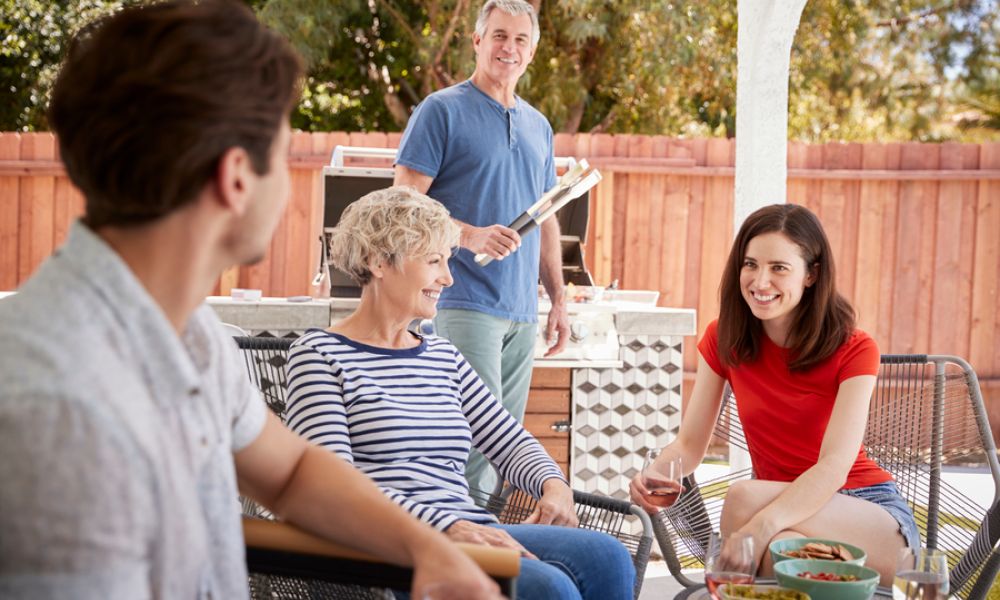<p>Family having a cookout in a sunny backyard.</p>